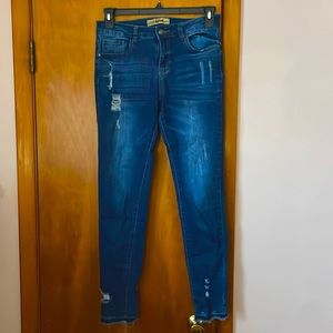 Ripped blue fitted high rise jeans. Size large